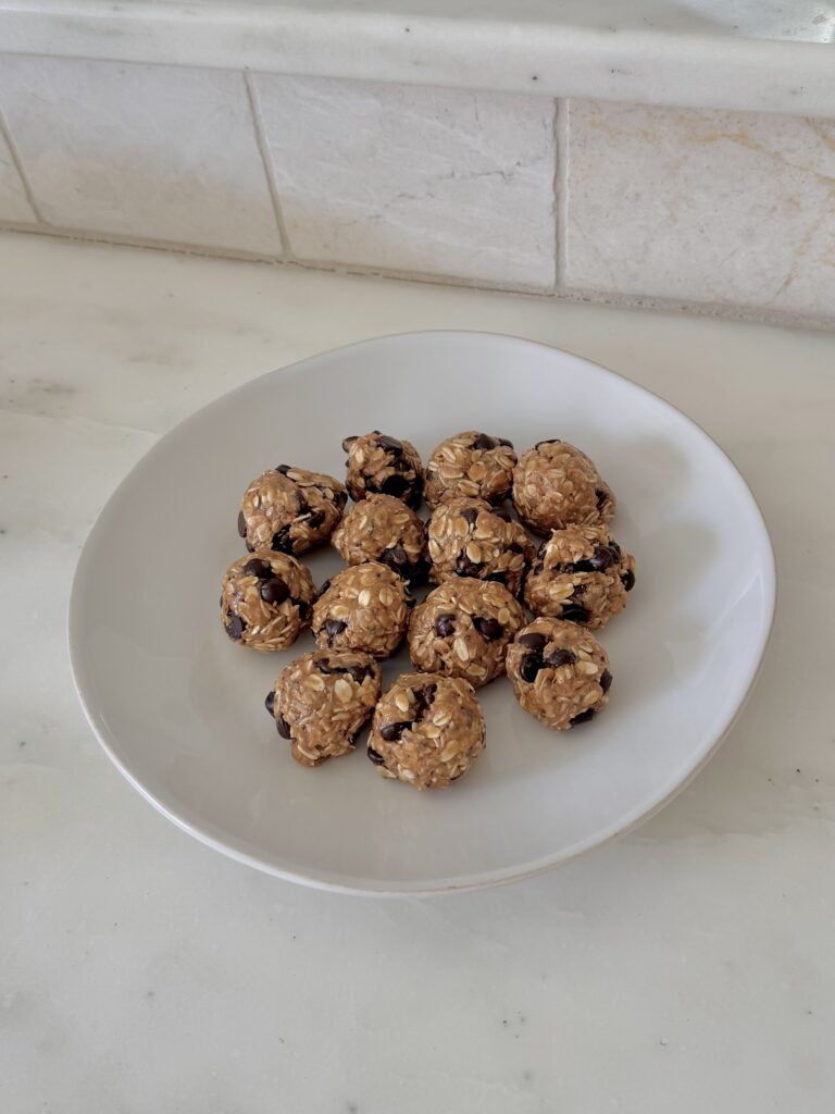 These Toasted Coconut Peanut Butter Protein Balls are so easy to make and are the perfect snack or breakfast! I love to make these when I have a busy week or am traveling. On our family trips theses are always a staple in the fridge and always are gone within the day I make them!  Gluten Free Dairy Free