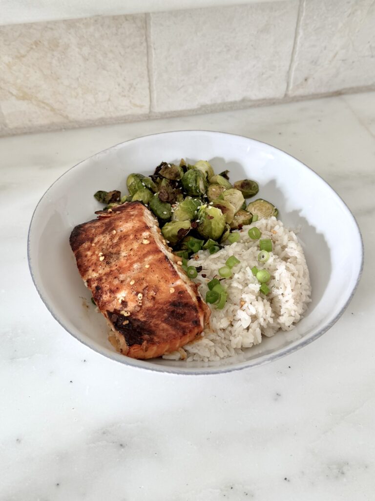 Honey glazed salmon with coconut rice and Brussels sprouts. 30 minute meal that is gluten free, dairy free and high in protein.