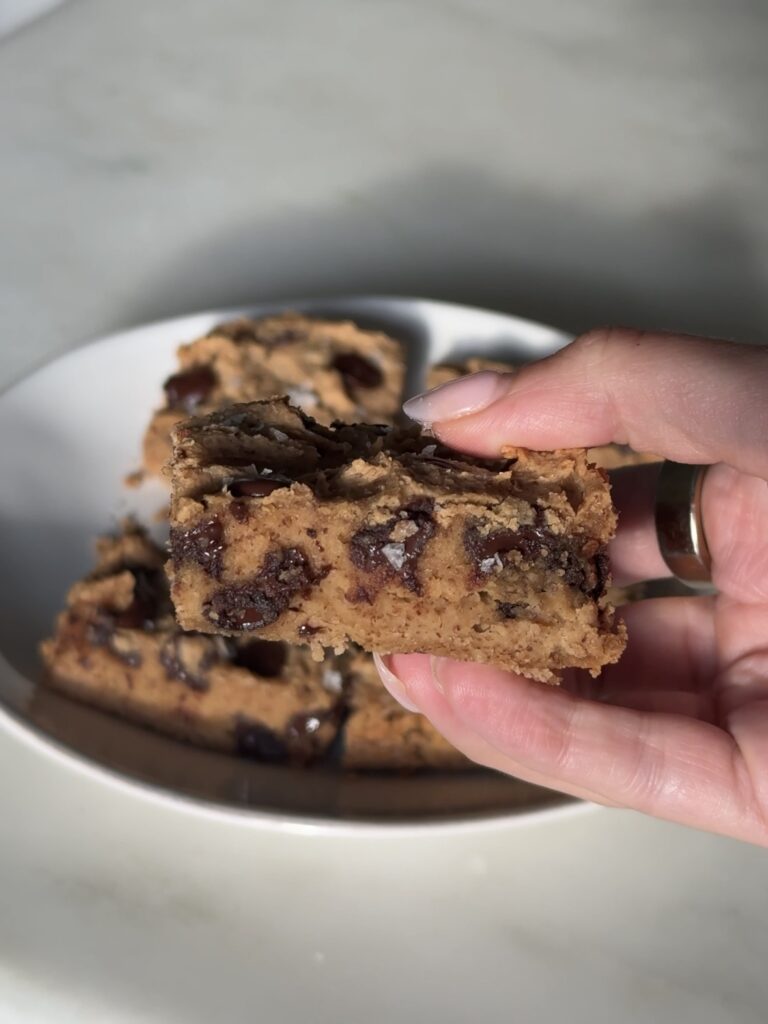 close-up of chickpea blondies showing soft, chewy texture and chocolate chips