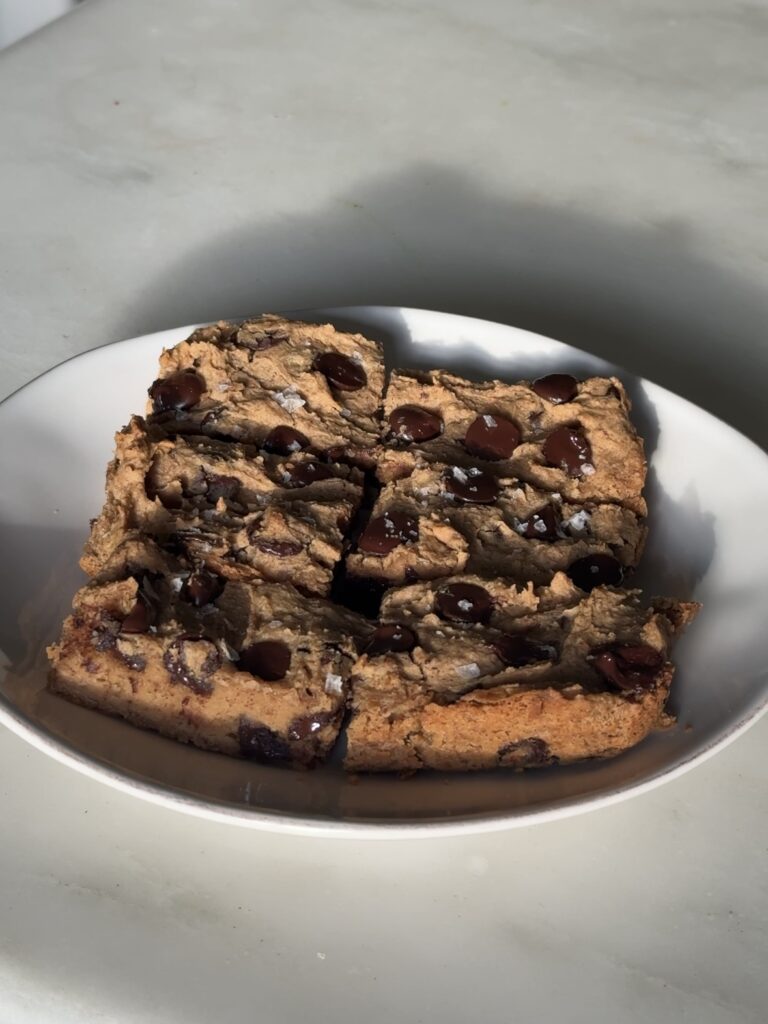 close-up of chickpea blondies showing soft, chewy texture and chocolate chips