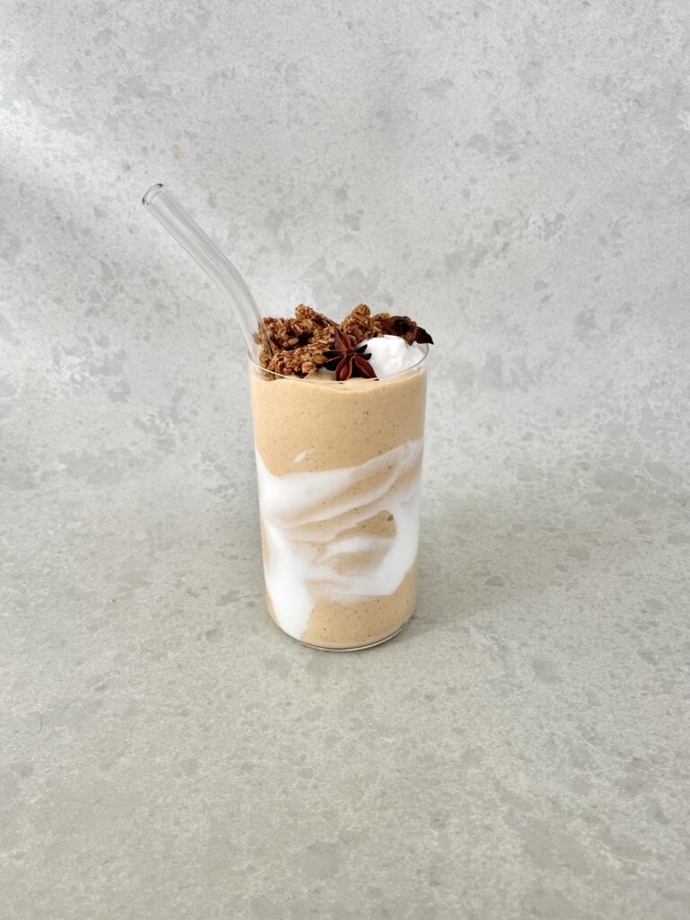 Thick and creamy pumpkin pie smoothie served in a glass