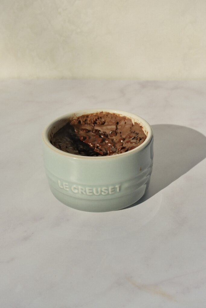 2-minute protein brownie made in the microwave, gluten-free and dairy-free, topped with chocolate chips and flaky sea salt